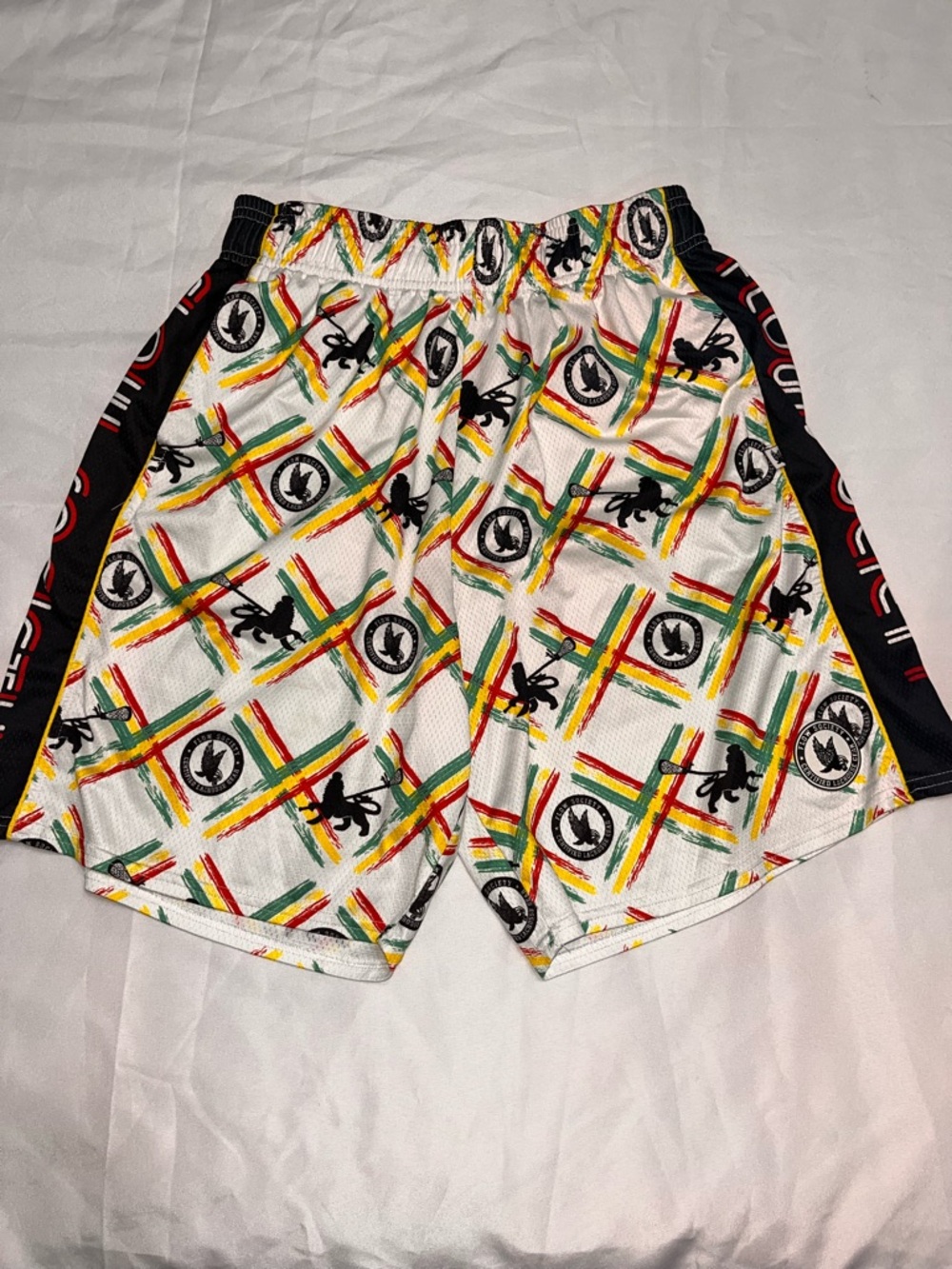EUC men’s FLOW SOCIETY Authentic lacrosse gear shorts. Medium Rasta Jamaican